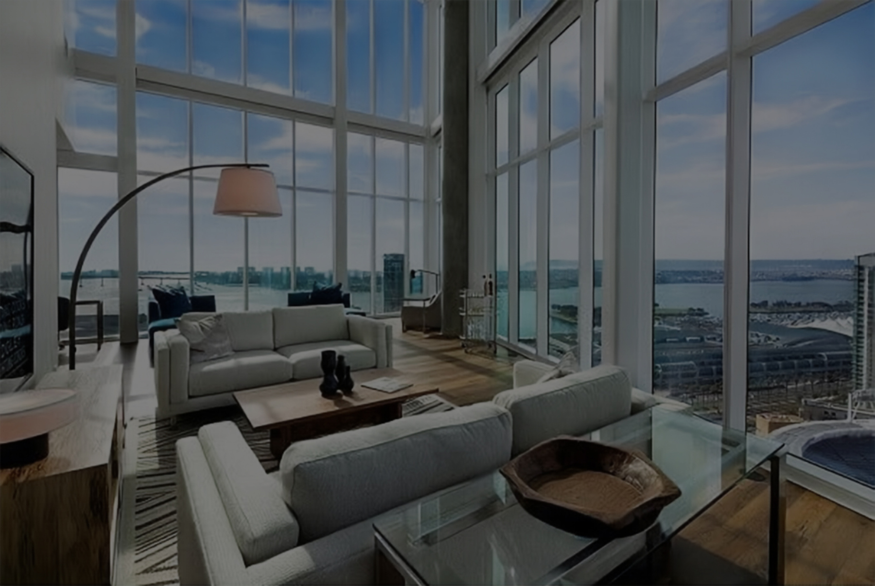 Rental property living room with floor-to-ceiling windows