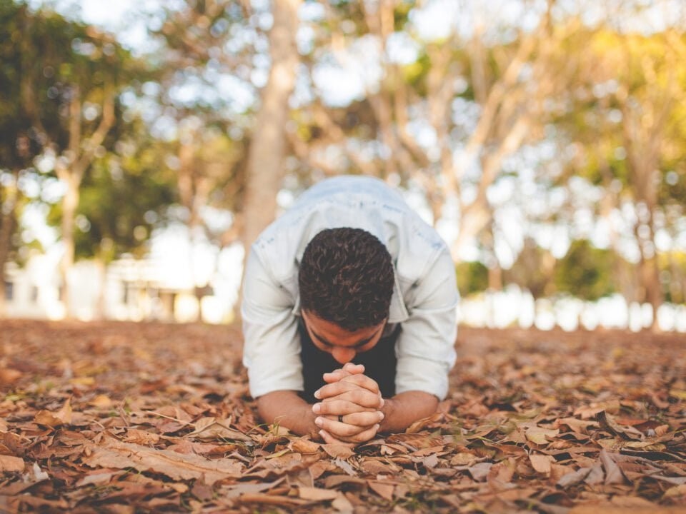 Man kneeling in prayer