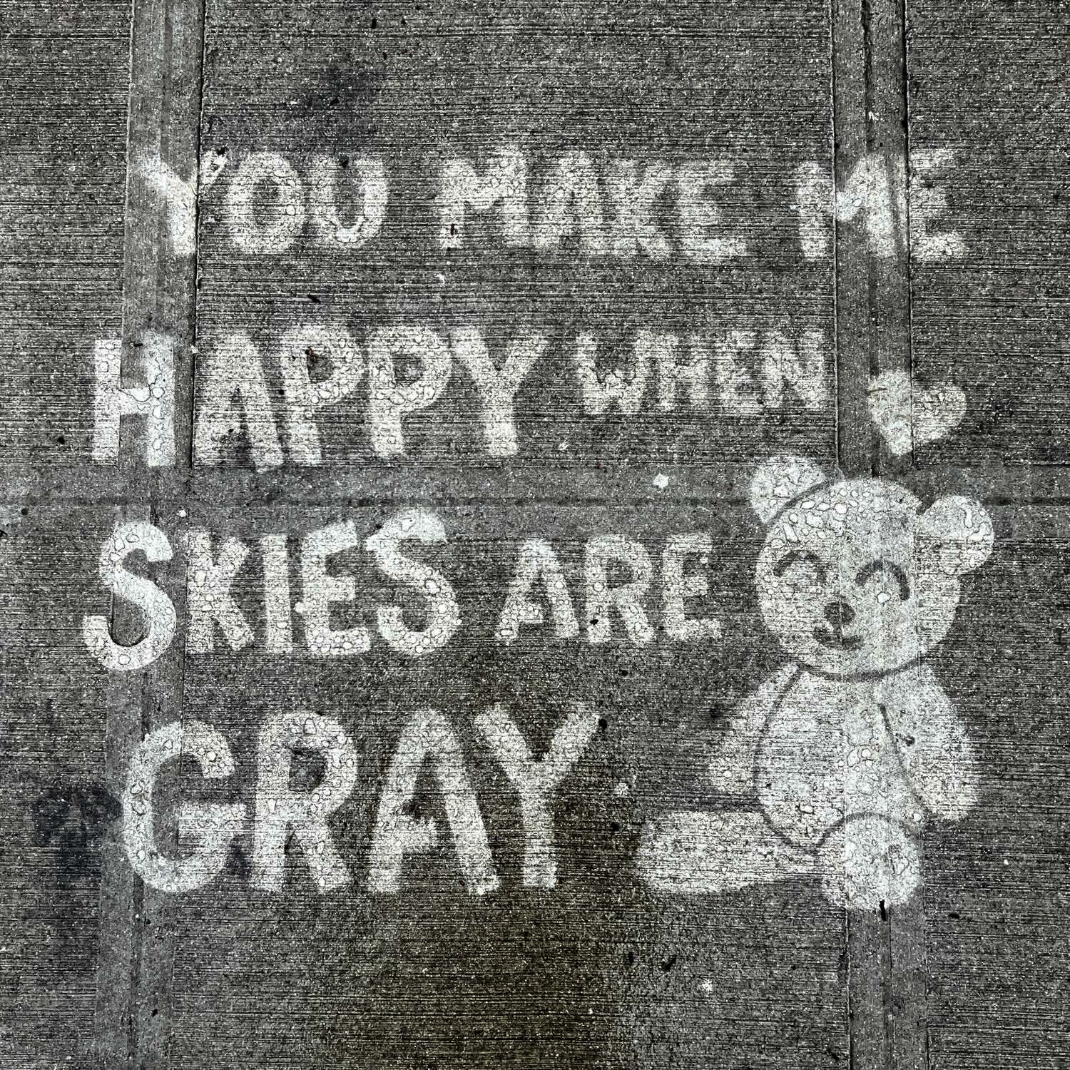 Rainwork that says “you make me happy when skies are gray“