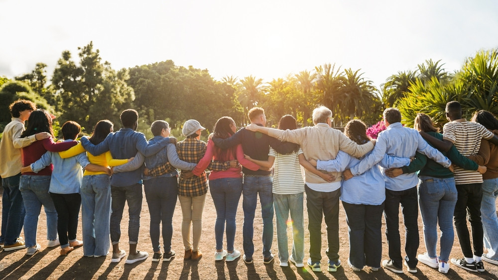 Group of people linking arms