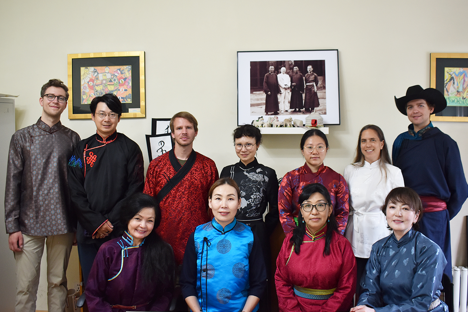 Seven people stand in a classroom and pose for the camera.Seven people stand in a classroom and pose for the camera.Seven people stand in a classroom and pose for the camera.