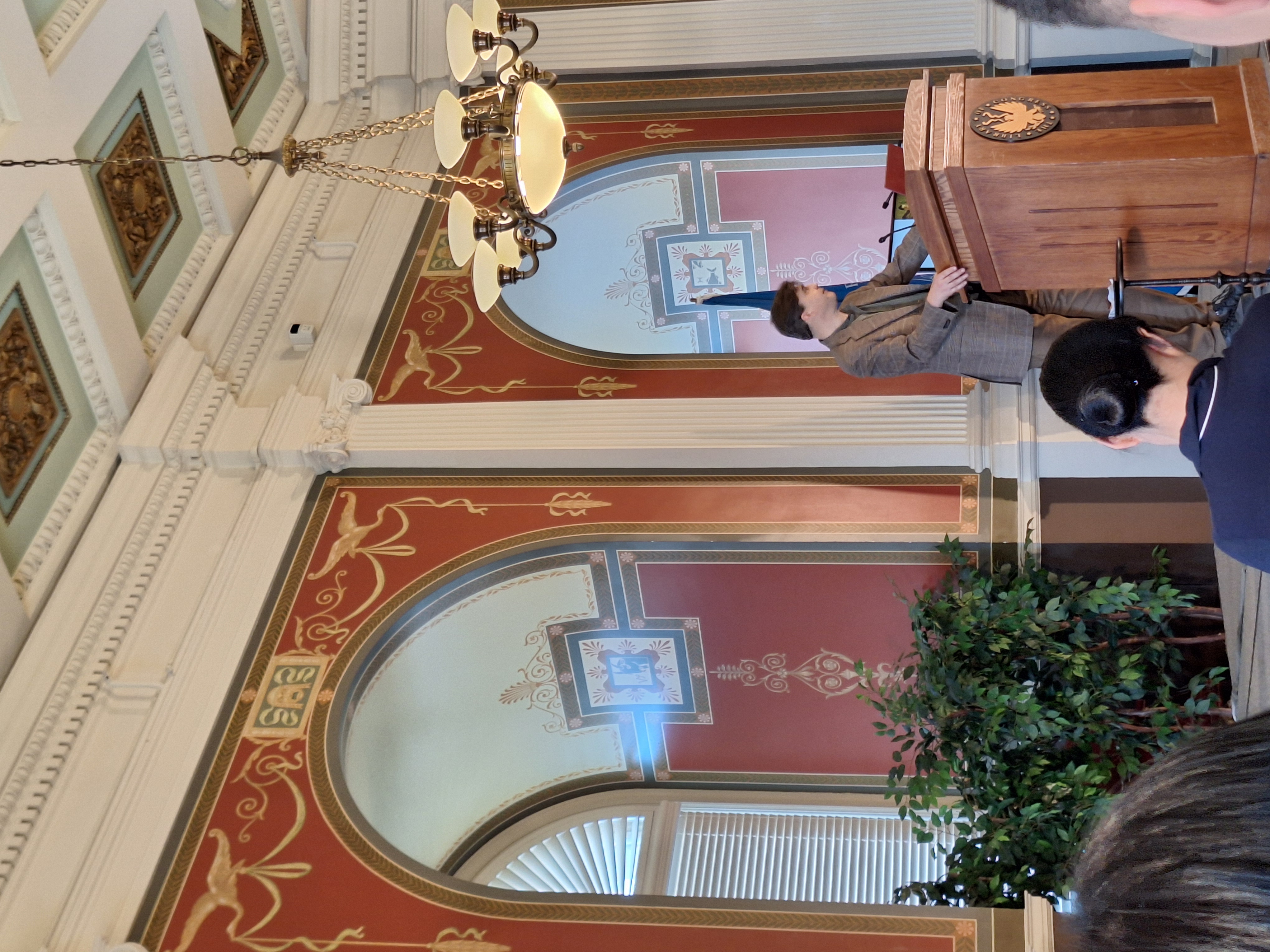 Dr. Simon Wickhamsmith standing at a podium in the The Library of Congress