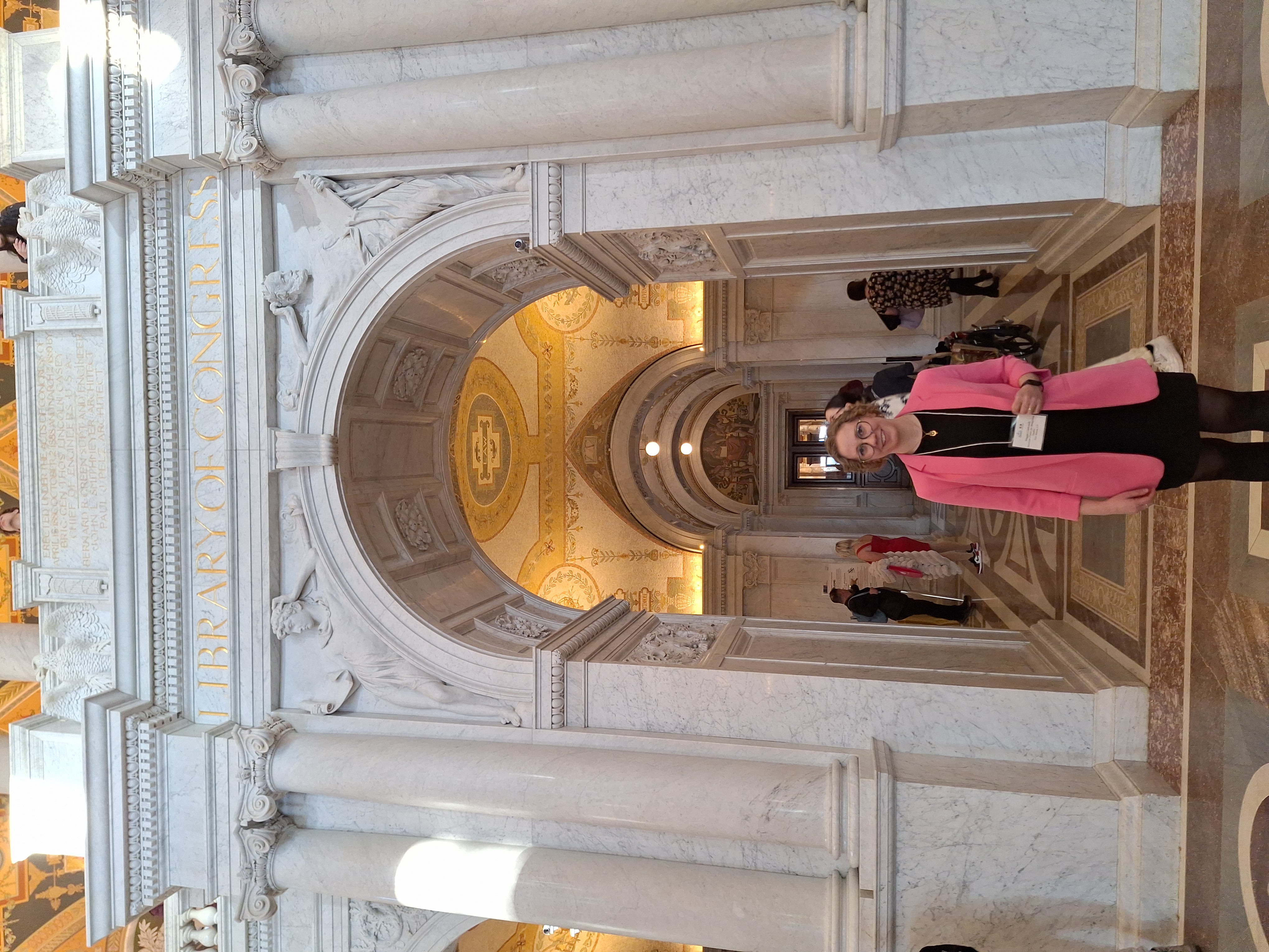 ACMS U.S. Director Maggie Lindrooth under an archway in the Library of Congress