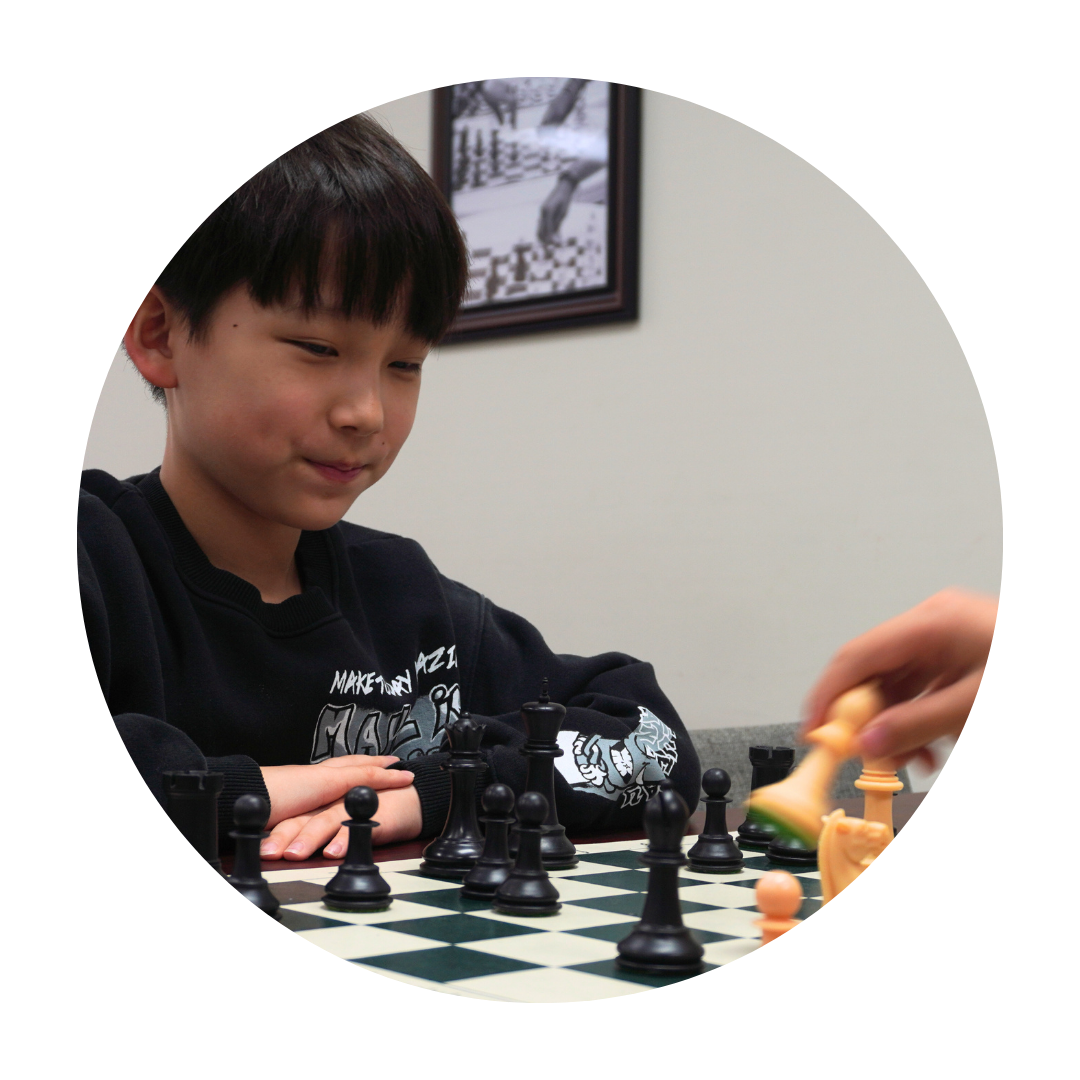 boy playing chess.