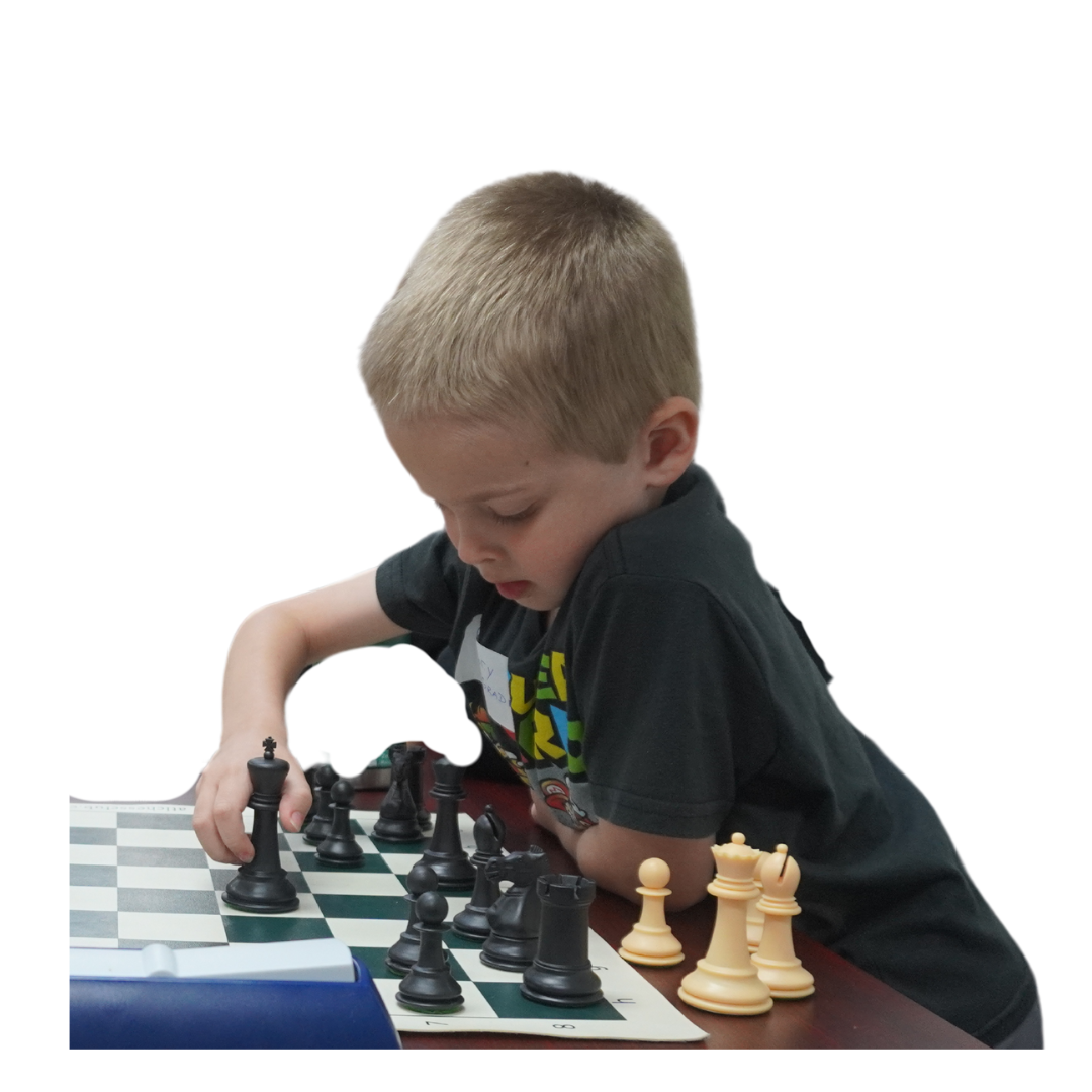 Kid in black shirt playing chess