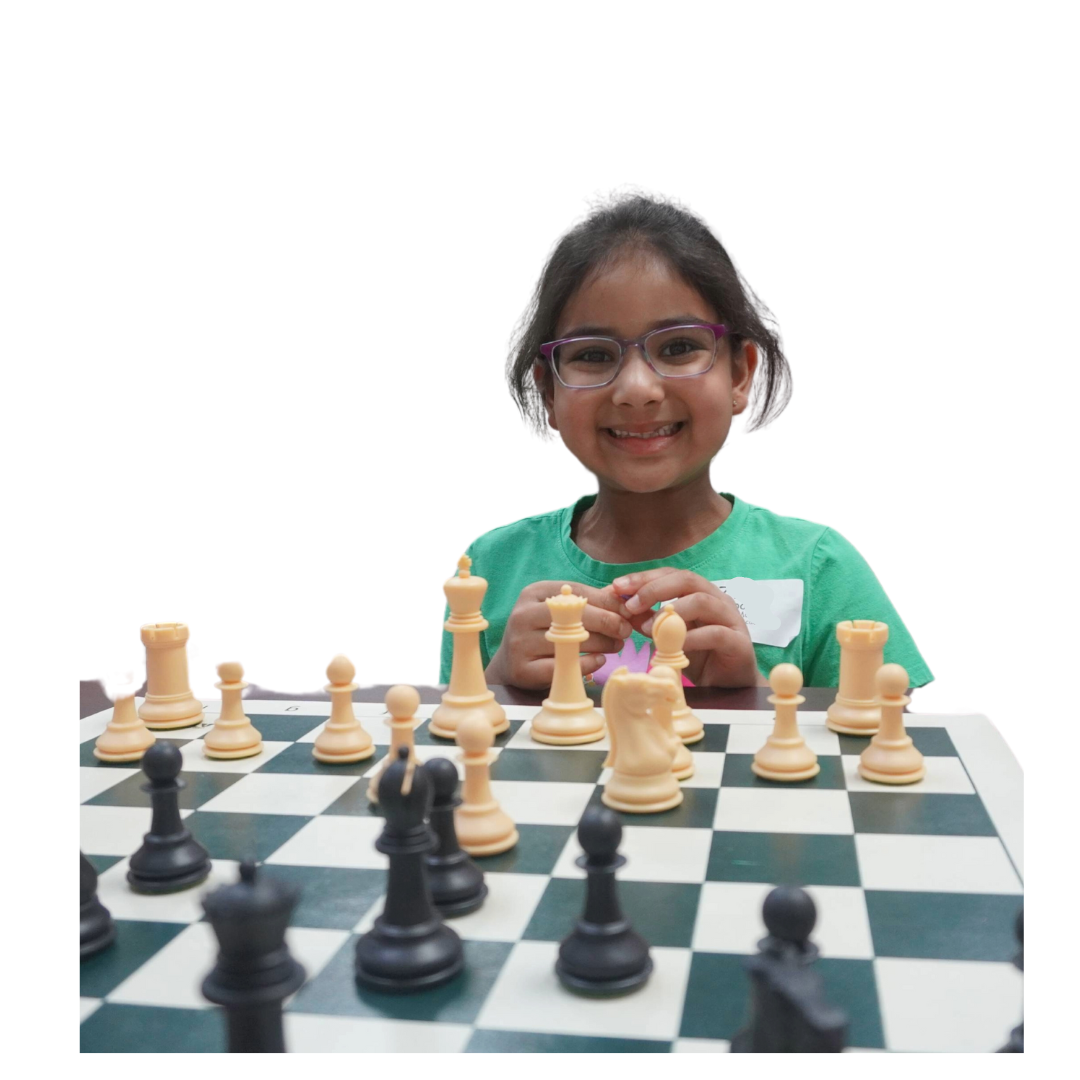 Girl smiling and playing chess