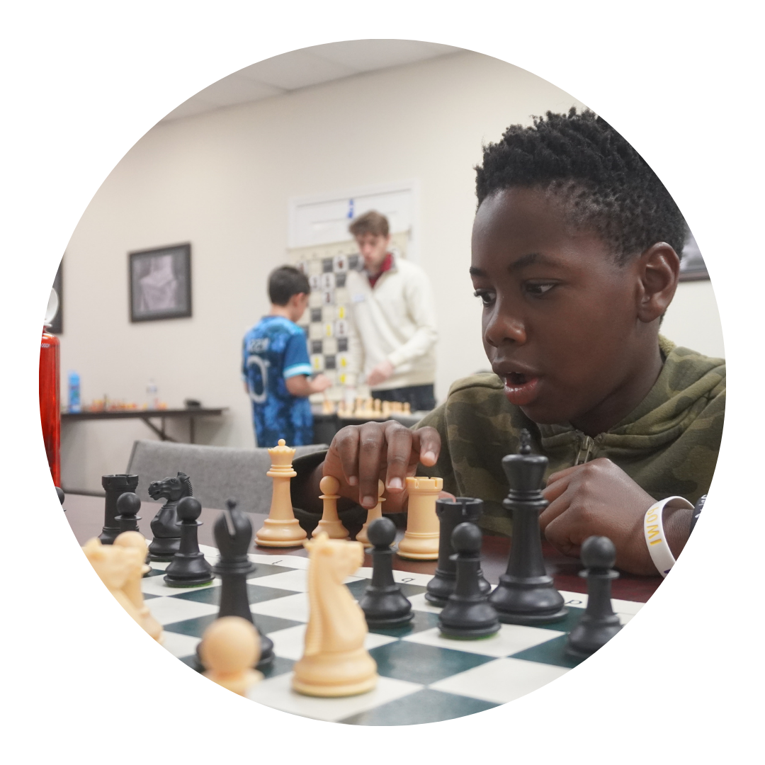 Boy figuring out a good chess move