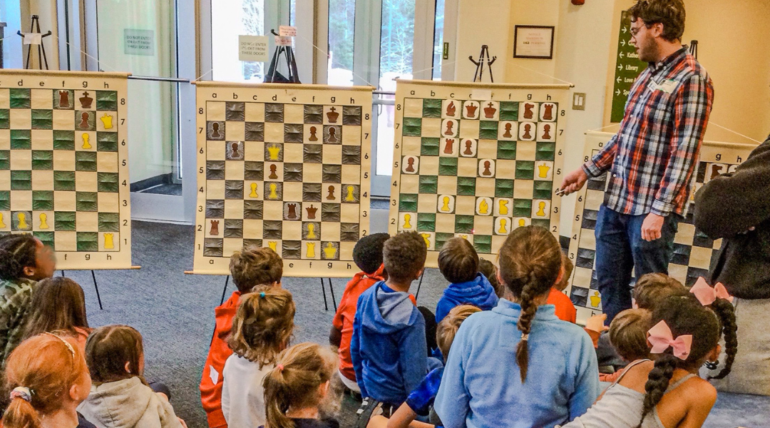 Man teaching chess