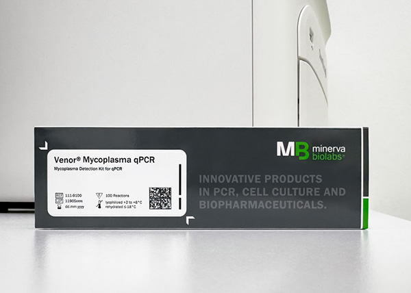 Photo of Venor® Mycoplasma qPCR packaging in front of a qPCR Cycler