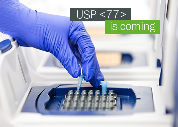 Photo of a person setting tubes in a PCR cycler