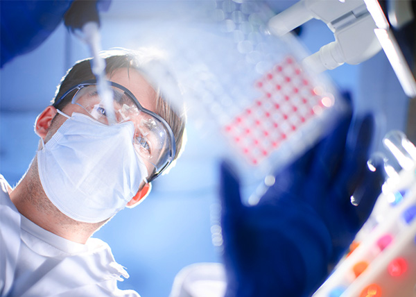 Photo of a person pipetting