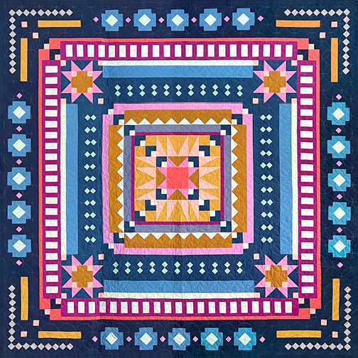 Tara Faughnan’s Roam medallion quilt is the perfect way to explore a beautiful harmony of colors and values, with a modern twist. Each round demonstrates a wide range of techniques that will build the skills of novice quilters and will be a fun play day for the experts. Techniques include traditional piecing, strip piecing and an easy no-tear paper piecing. High-quality quilter’s cotton will be used, fabric substitutions will match as closely to the photo as possible.  During this 12-month program, you will receive the pattern and fabrics necessary to complete the quilt top, including border and binding. 