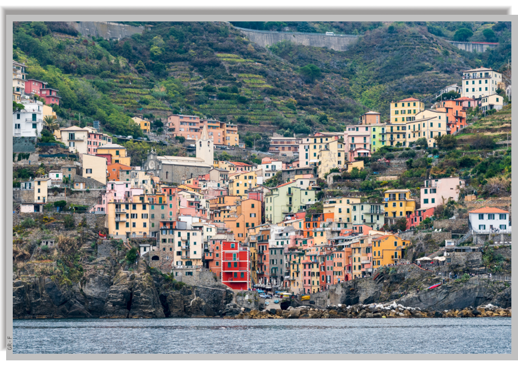 The colorful houses of Riomaggiore, perched on the hills overlooking the sea