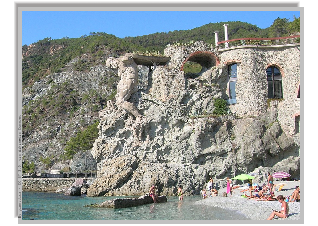 The statue of the Giant on a rock projecting on the sea