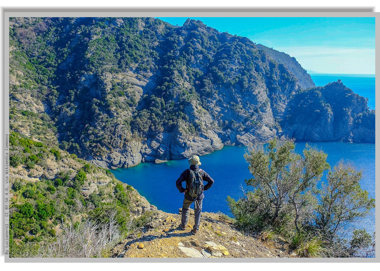 Hiker looks at the sea from a hill above Portofino