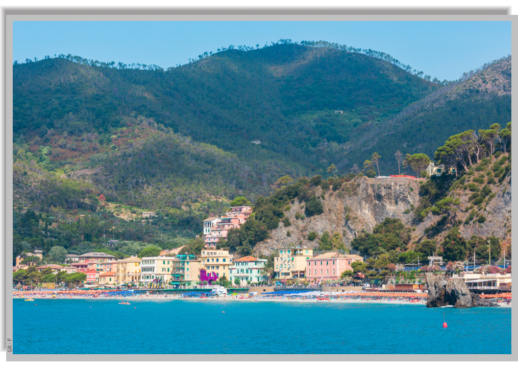 Coastline of Monterosso, with green hills at its back