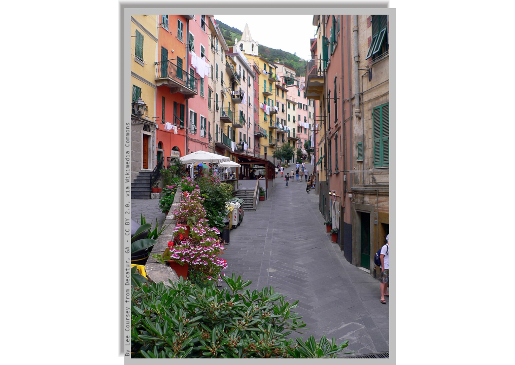 A small picturesque internal street of Riomaggiore lined with houses adjacent to each other