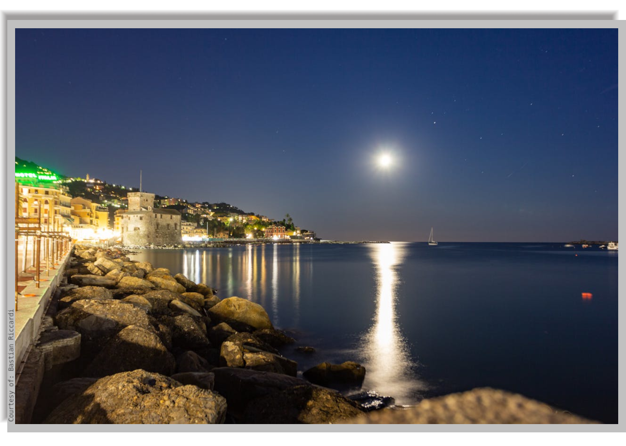 The Moon reflected on the calm walters of the Bay, at night