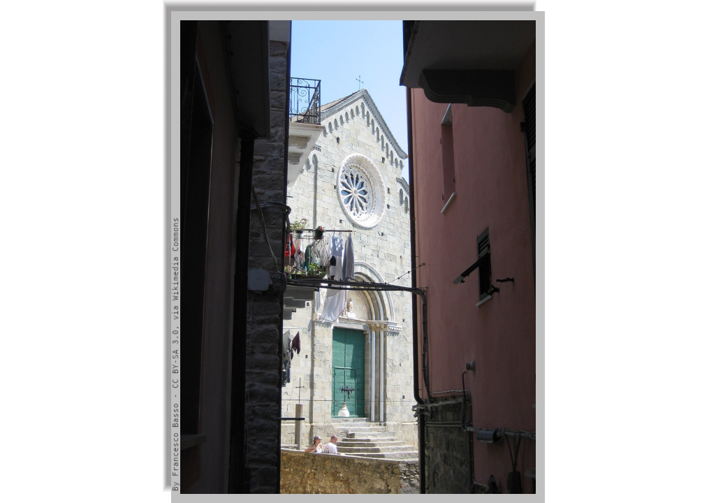 A glimpse of the Church facade through a space between houses
