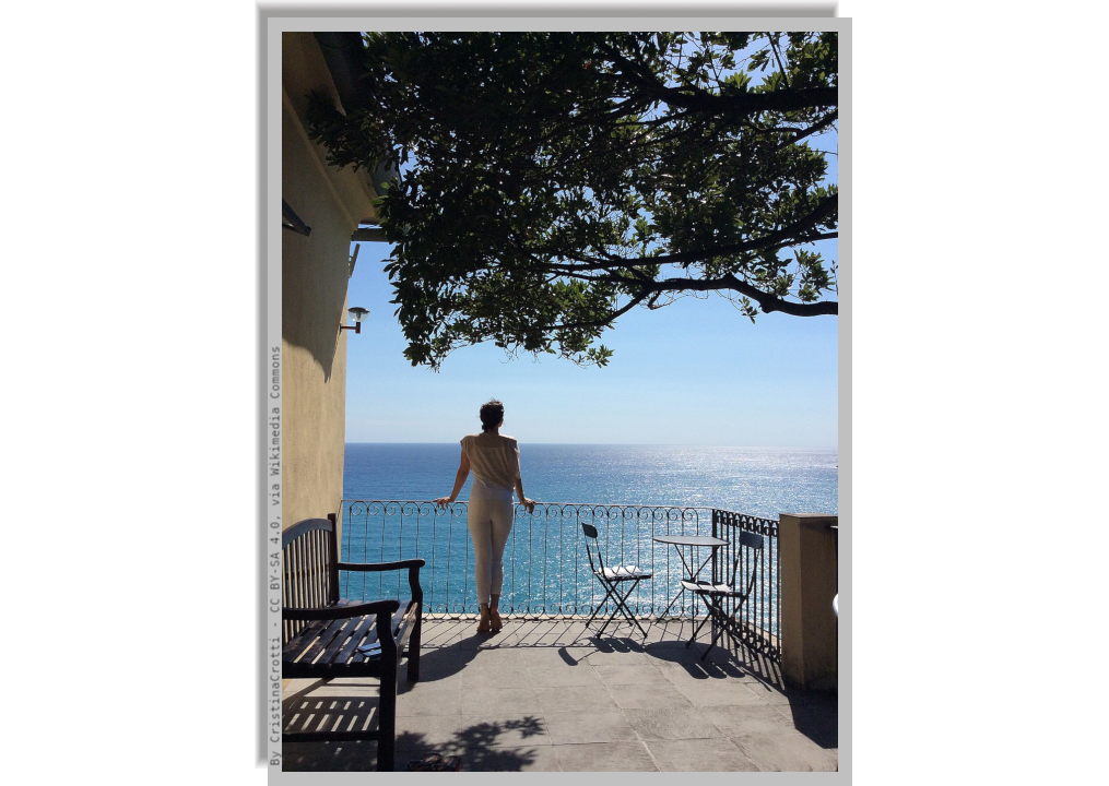 Woman admiring the marine panorama from a terrace under the foliage of a tree