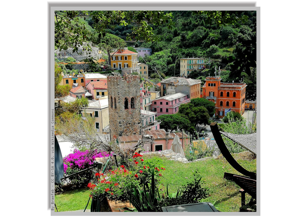 A glimpse of some coloured houses and the bell tower of the church of Monterosso