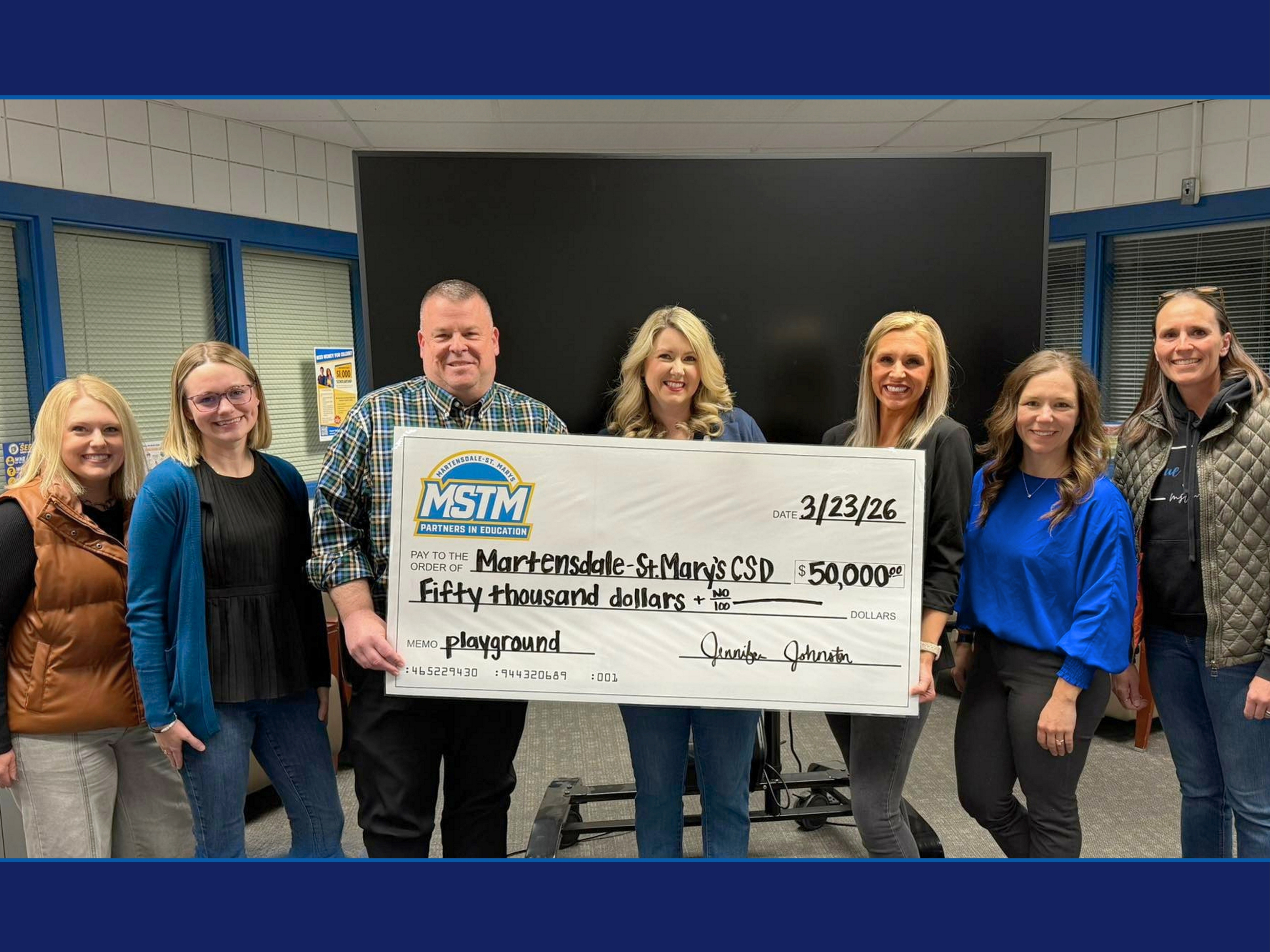 Giant check photo for the playground donation
