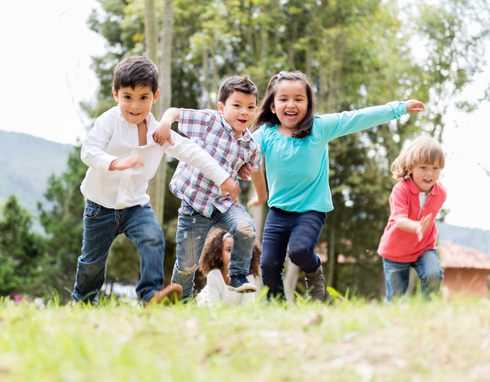 kids smiling and playing together outside