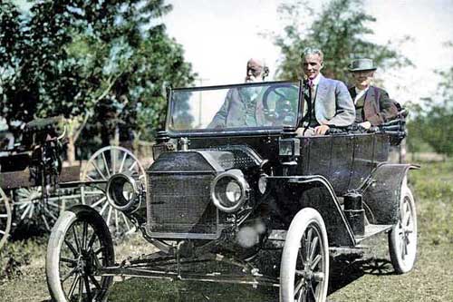 Henry Ford is driving with inventor Thomas Edison, seated in the back, and naturalist John Burroughs. This photo from 1914 has a touch of color by LOA.