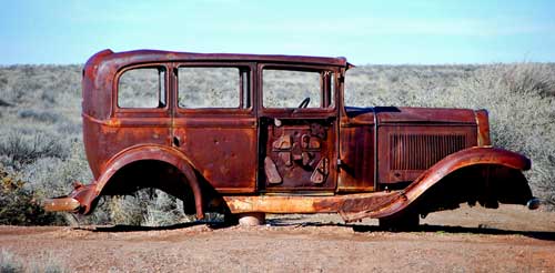 An old car on Route 66 where it once ran through the Petrified Forest National Park. Photo by Dave Alexander.
