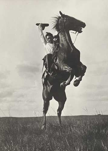 Photographer Erwin E. Smith riding a “Sunfisher” on Bonham, Texas, 1908.