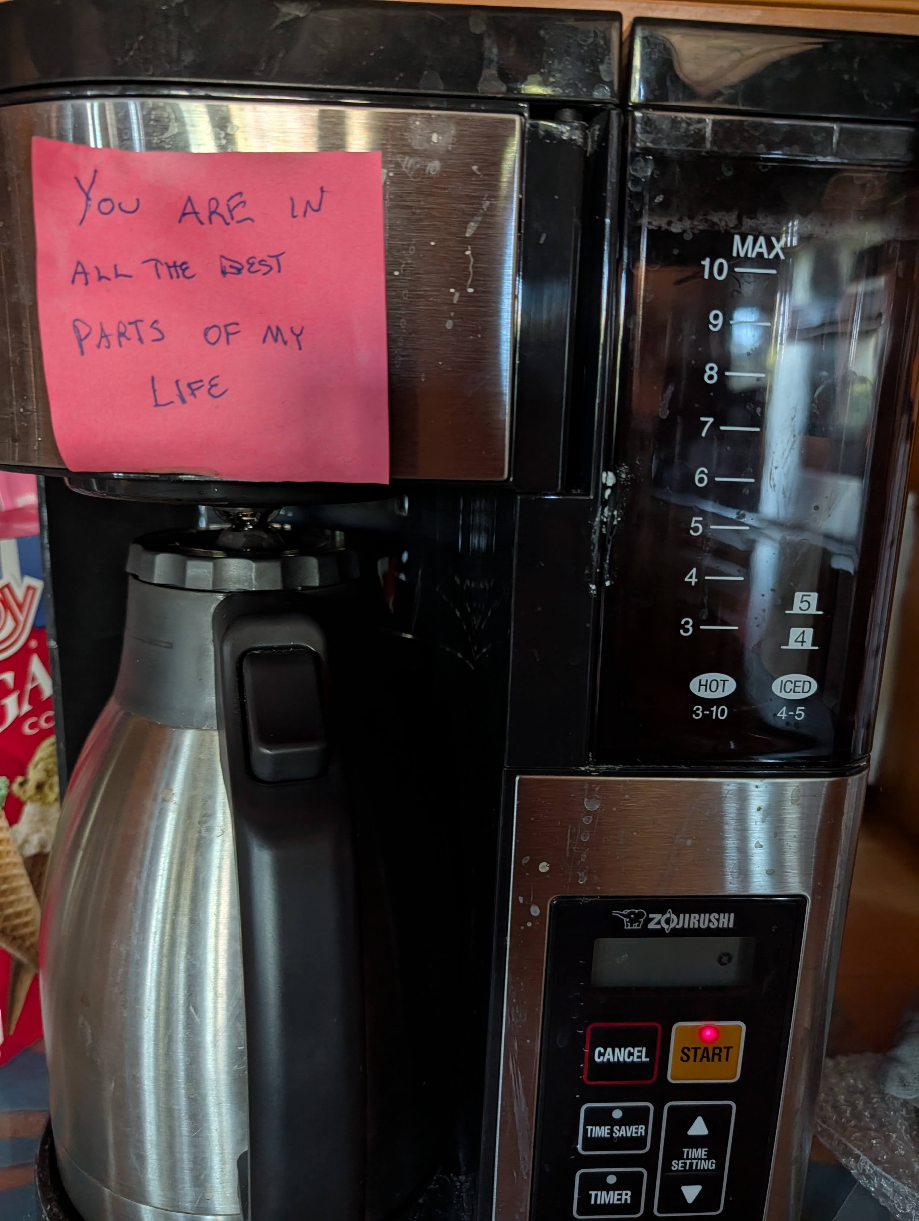Picture of a coffee maker with a pink Post-it that says “You are in all the best parts of my life.“