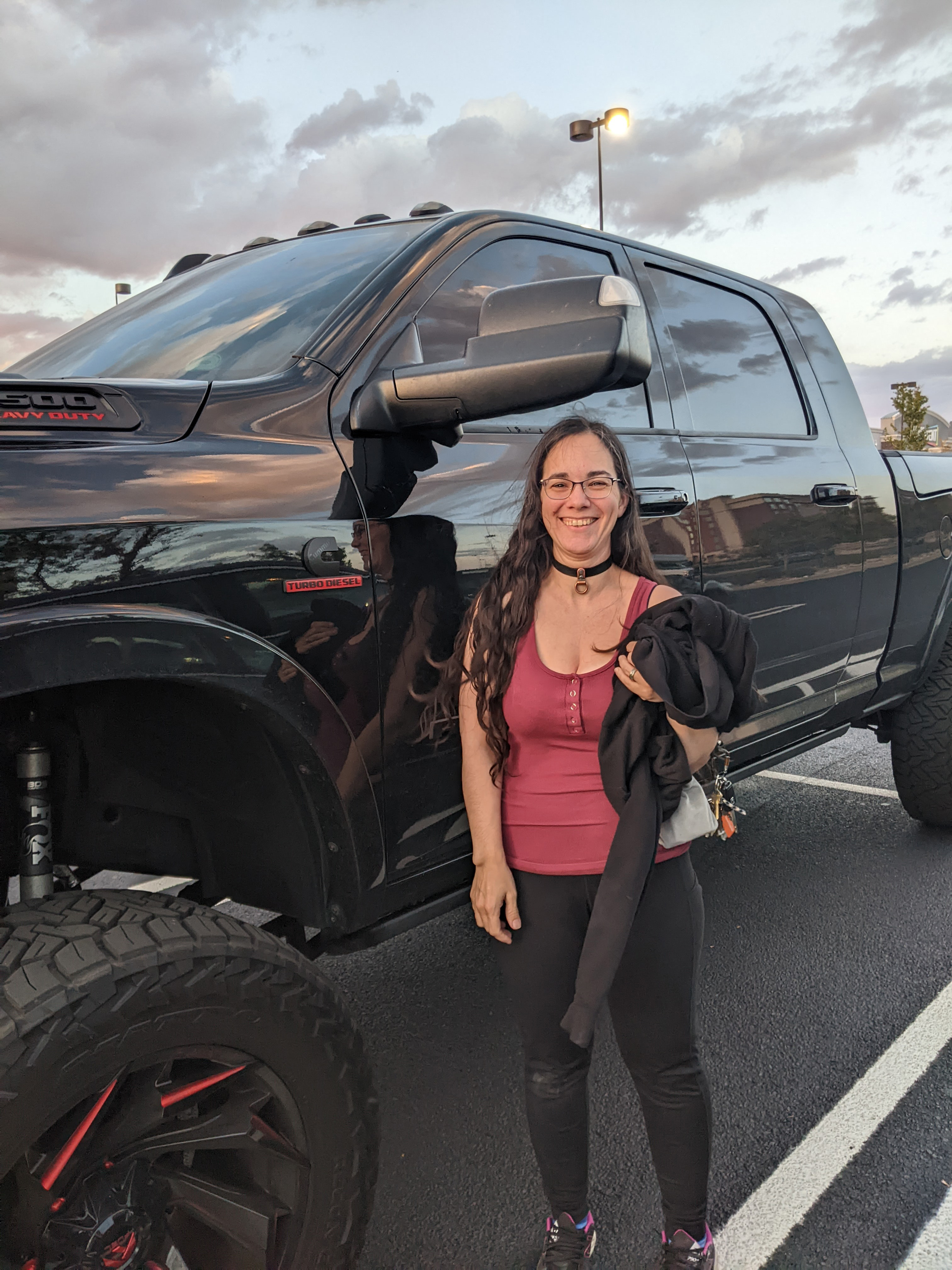 Me standing in a parking lot under the rearview mirror of a massive black truck. Mirror is two inches over my head and I'm 5'3“.