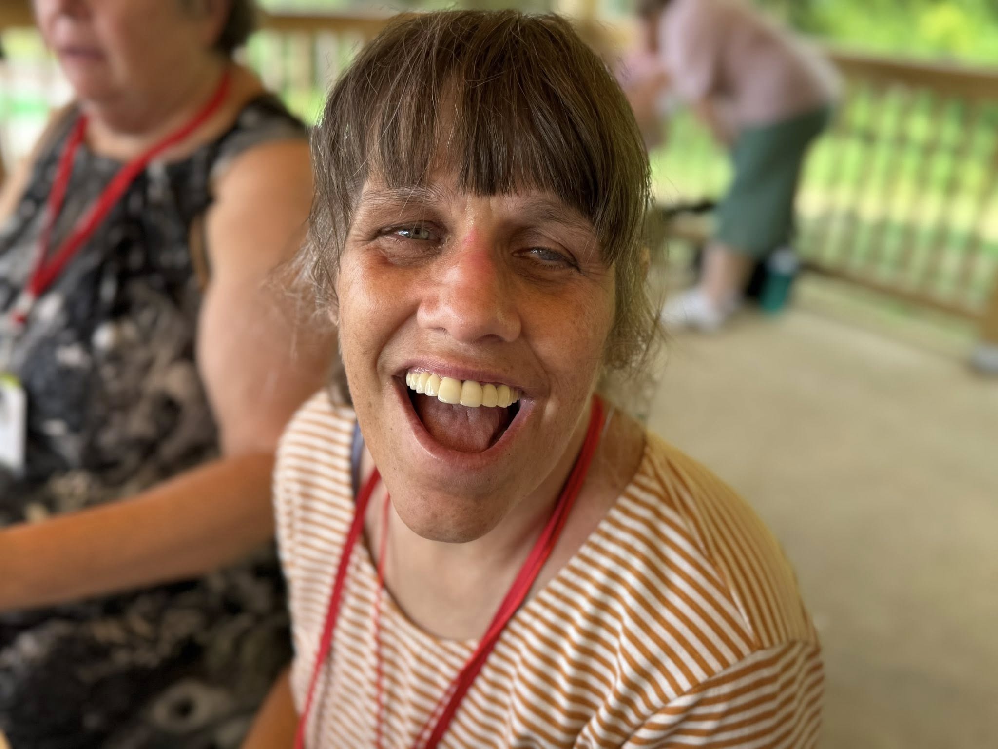 A woman smiling and laughing.