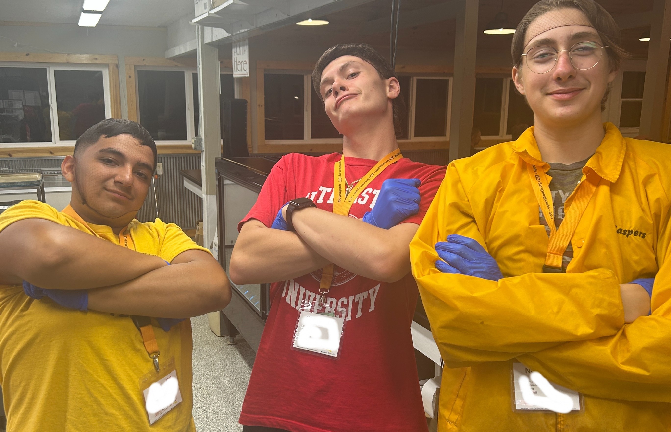 Three young men posing for the picture at Wisconsin Camp