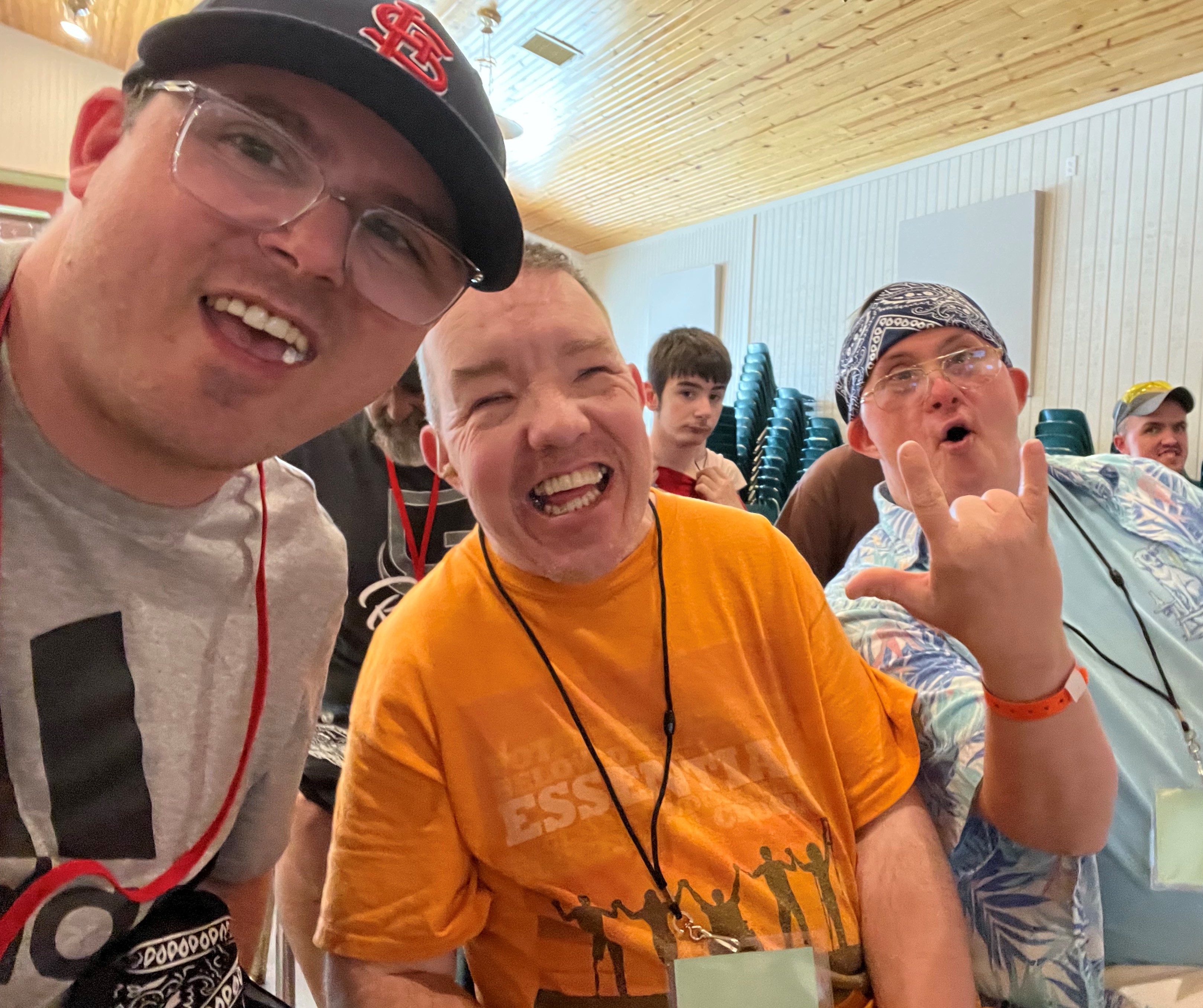 Three guys smiling and laughing at the camera