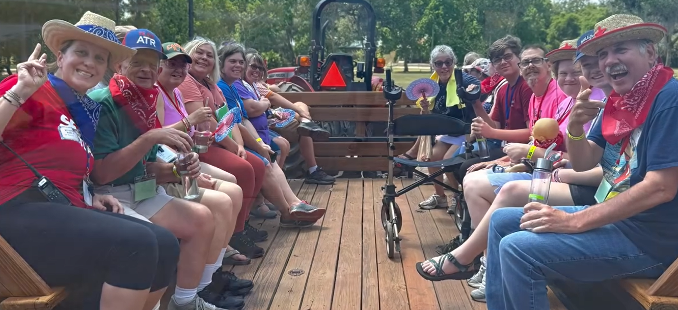 A group of people having fun on a hay wagon ride