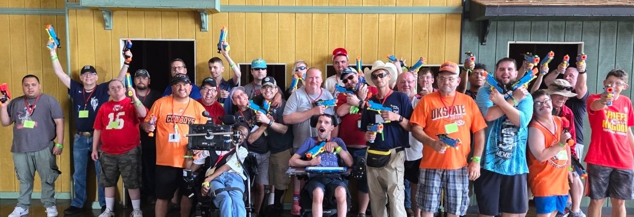 large group of guys all carrying squirt guns