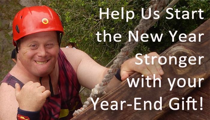 Help us start the New Year stronger with your Year-end Gift! Man climbing a wall with a rope
