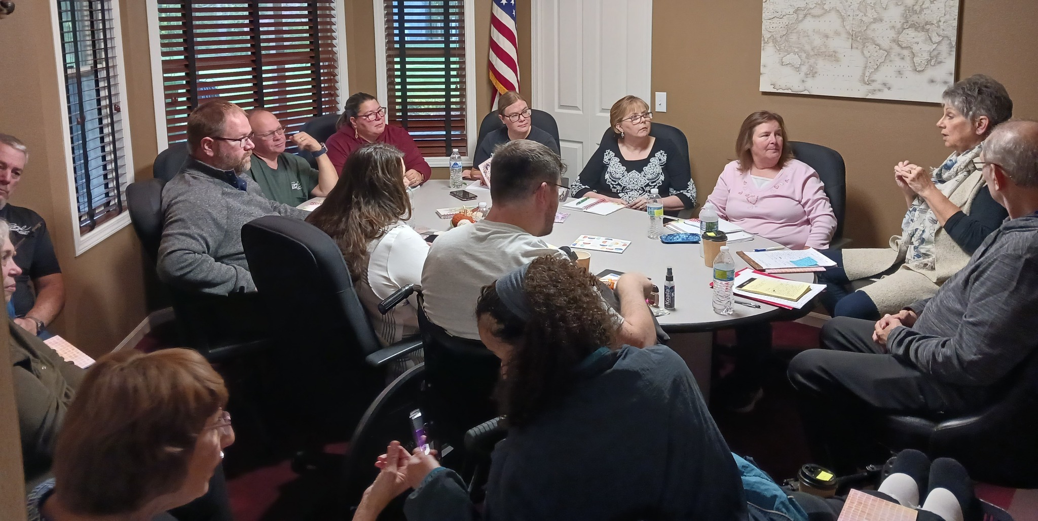 Group of leaders around table in conference room