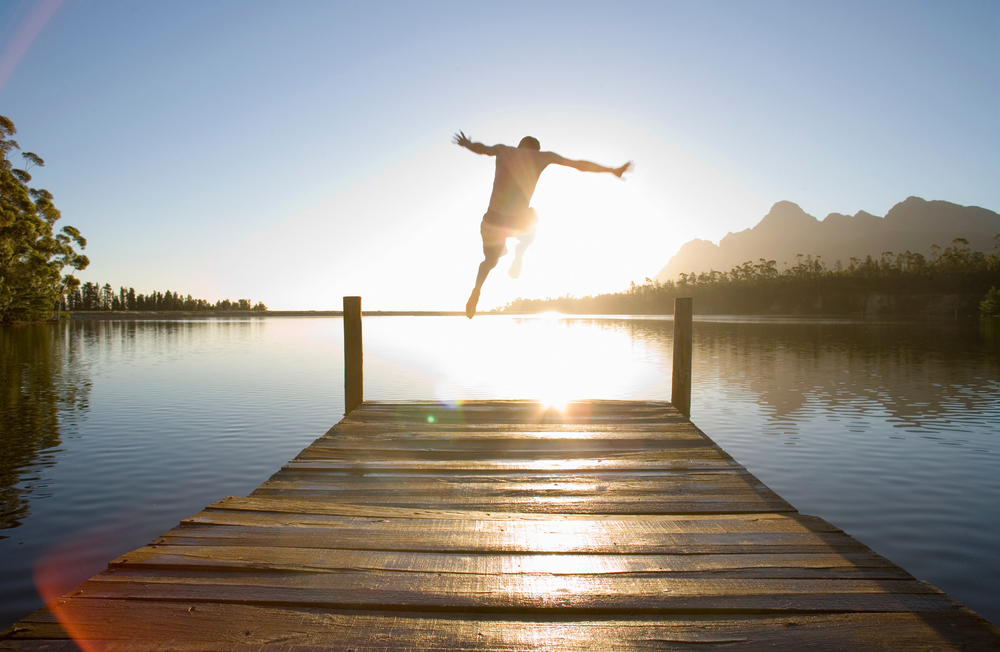 Person diving off a deck