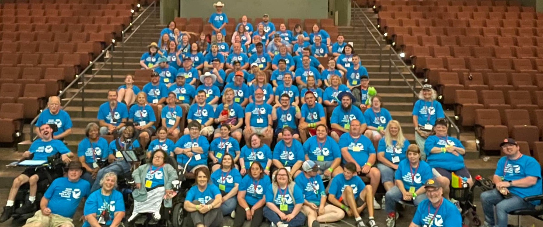 Huge group of people all in blue tweet how you want to be tweeted shirts