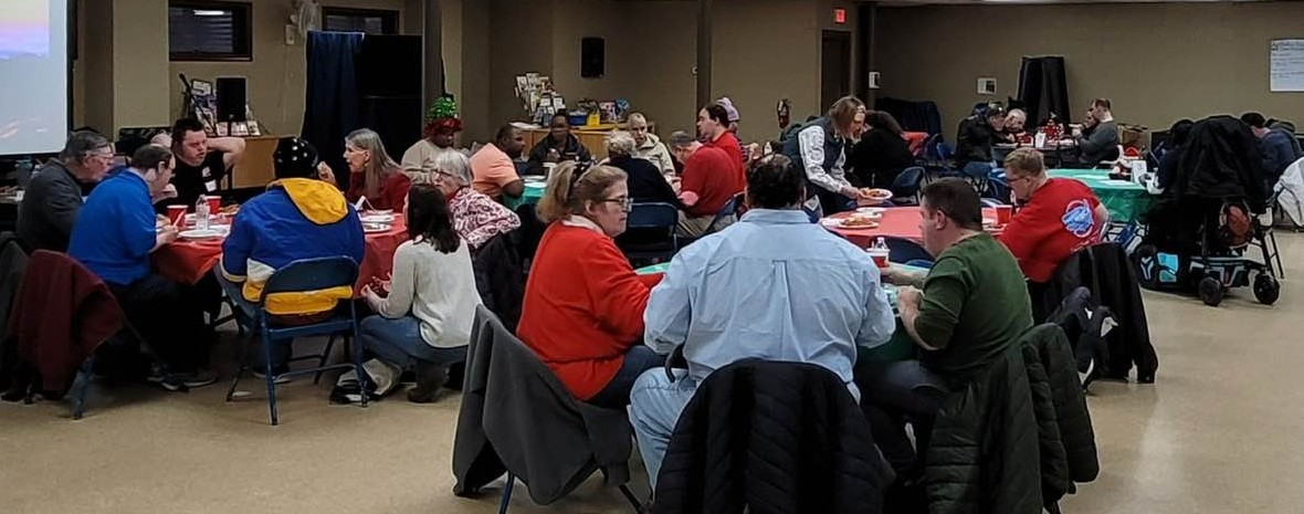 A large group of people all sitting around tables