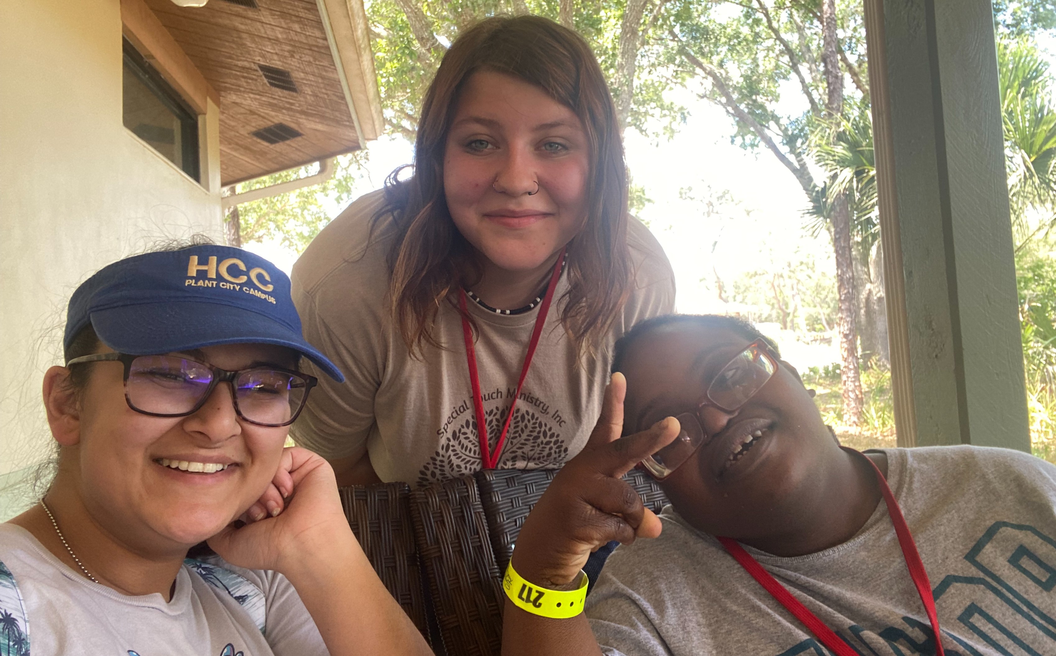 three women smiling and posing for the camera