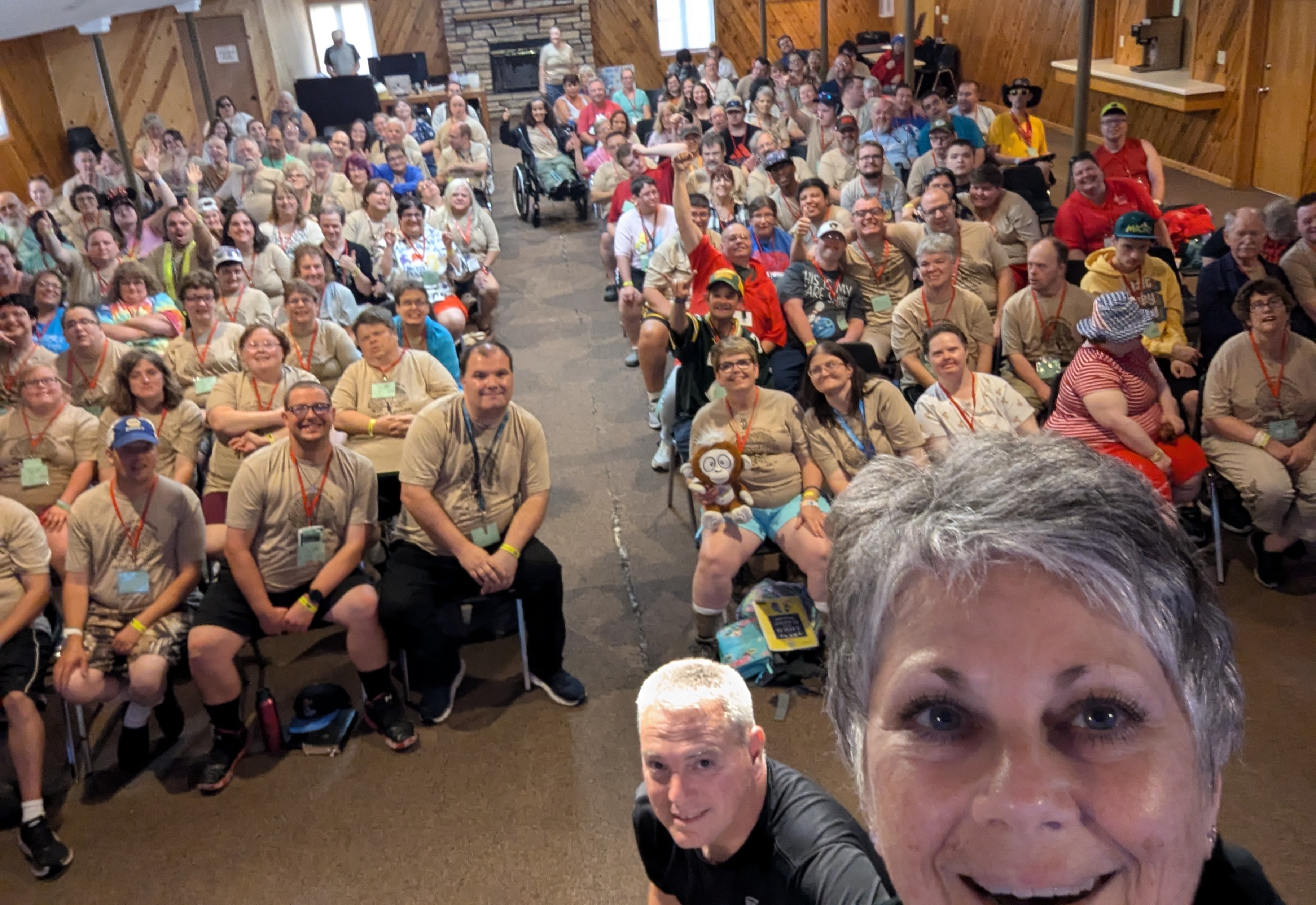 Our leaders taking a selfie with a room full of people