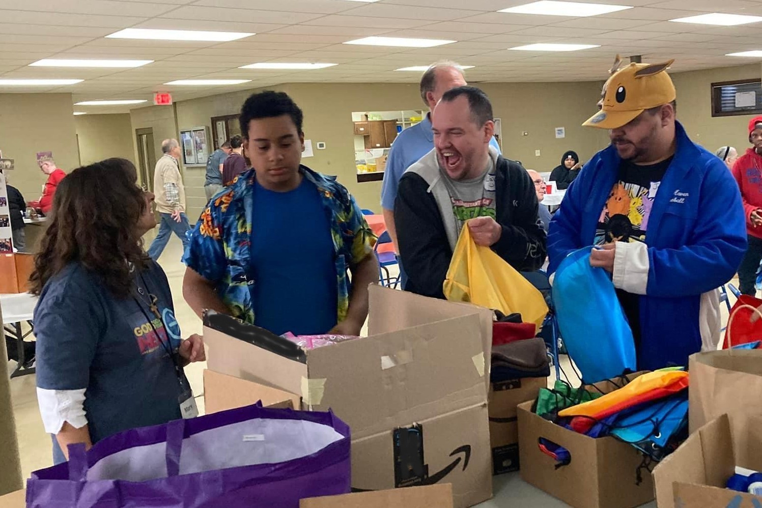 A number of Chapter members laughing and helping assemble care packages