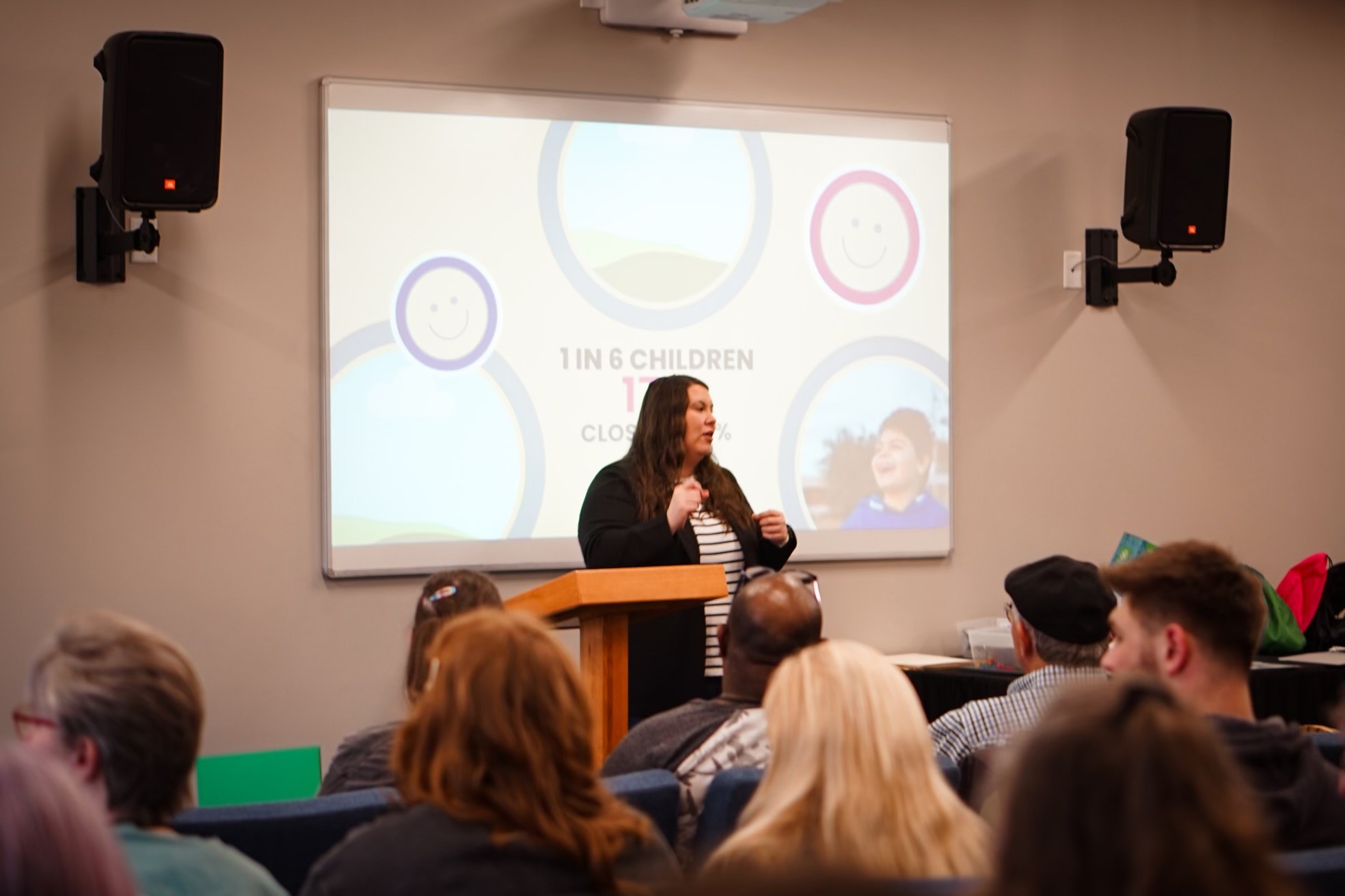 MA Tracie Corll in front of a room full of people