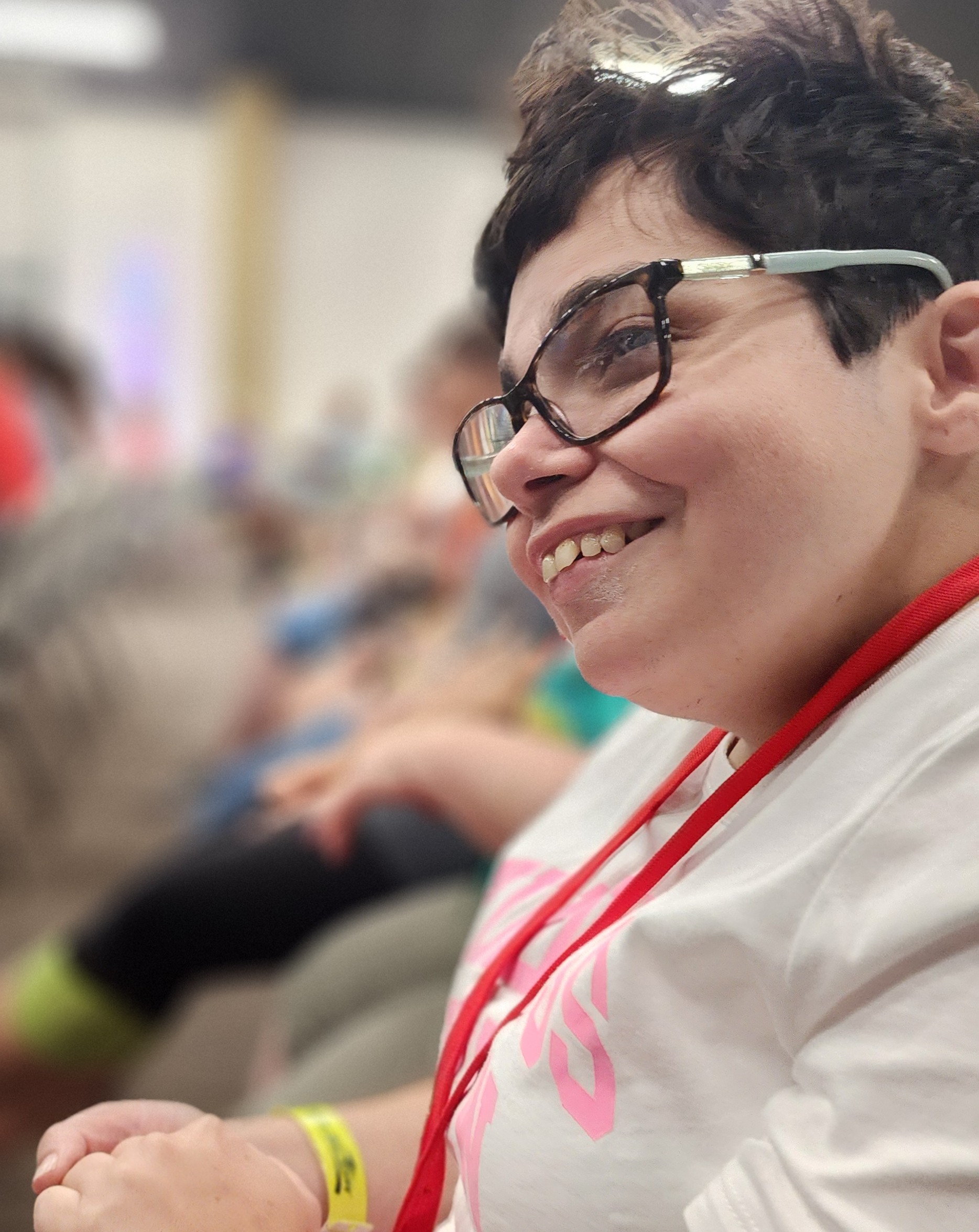 closeup of a woman smiling and having a good time in a group of people