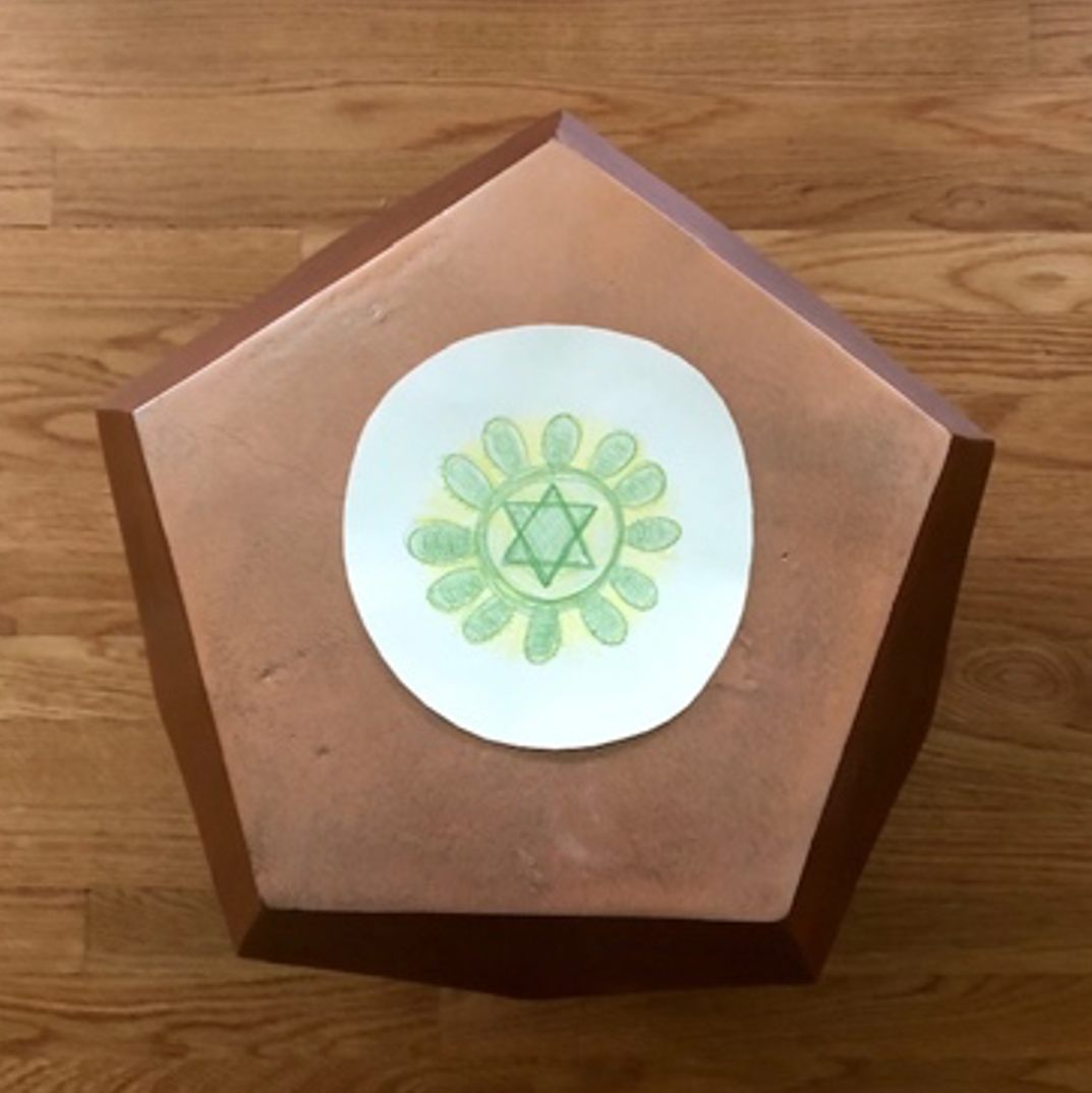 Image of a metal dodecahedron with a pencil drawing.  