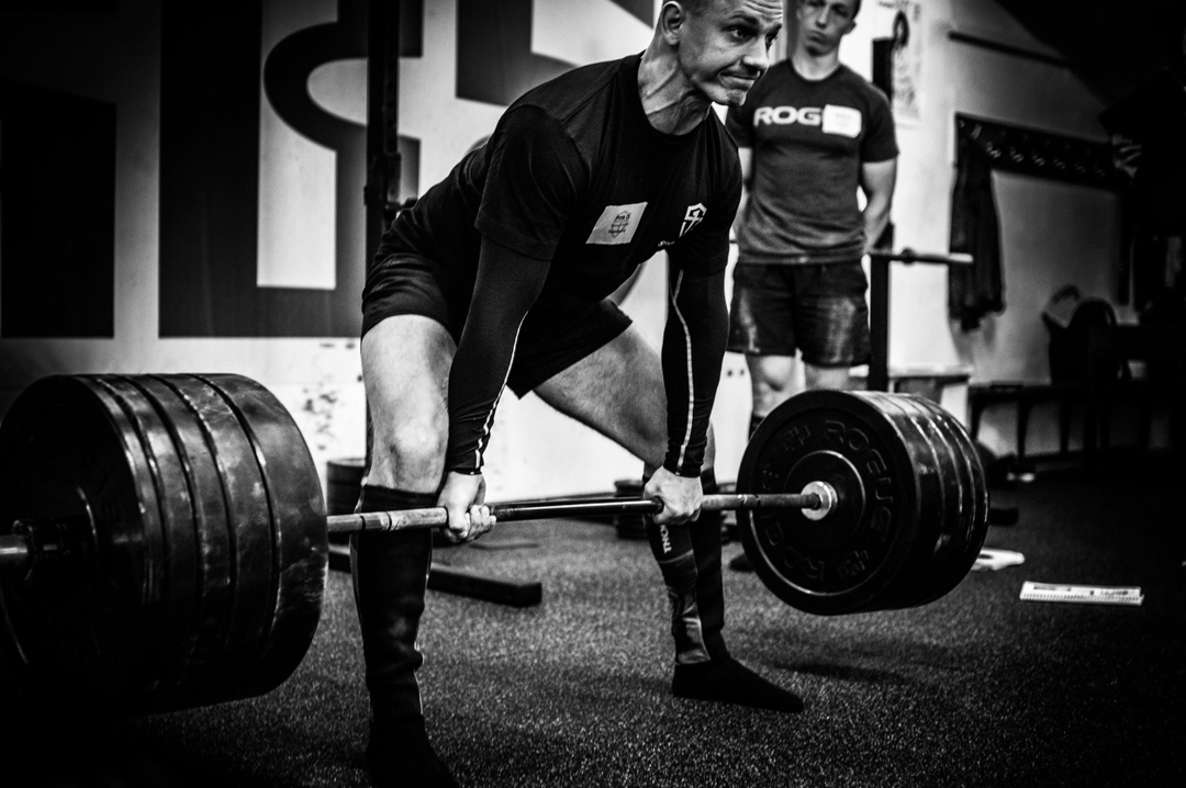 A student performing the sumo deadlift
