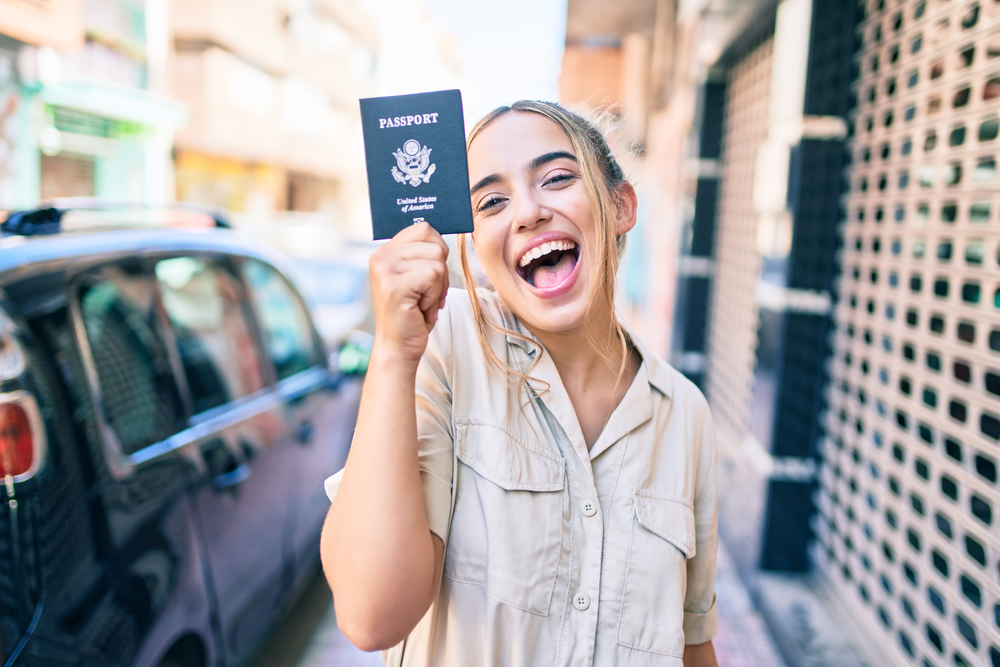 solo women traveler holding passport